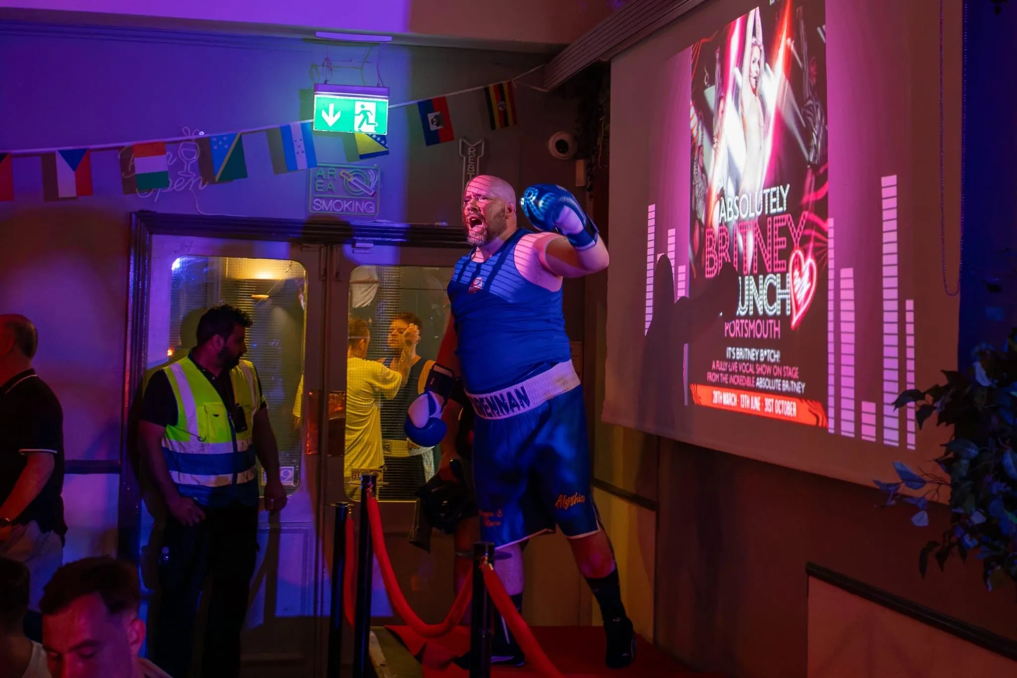 Fighter making a ring walk from the blue corner